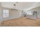 Open layout showcasing the kitchen with modern appliances, an island, and stylish wood flooring throughout at 4010 Herblinda Ln, North Las Vegas, NV 89032