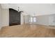 Bright, open living room featuring new floors, vaulted ceiling, fireplace, and a view to the front door at 4010 Herblinda Ln, North Las Vegas, NV 89032