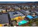 Expansive aerial view of modern home featuring a sparkling pool, covered patio, solar panels, and landscaped backyard at 461 Highview Ridge Ave, Las Vegas, NV 89138