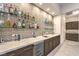 Wet bar with granite counters, tile backsplash, and storage cabinets at 461 Highview Ridge Ave, Las Vegas, NV 89138
