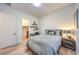 Bedroom featuring a full-sized bed, wood nightstand, and doorway to a shoe closet at 461 Highview Ridge Ave, Las Vegas, NV 89138