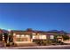 Modern home exterior featuring a contemporary design, three-car garage and desert landscaping at 461 Highview Ridge Ave, Las Vegas, NV 89138