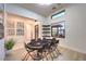Game room with tile flooring and light wood floors and game table set for eight, and natural light at 461 Highview Ridge Ave, Las Vegas, NV 89138