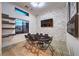 Modern game room featuring a stone accent wall, TV, and poker table with seating for eight people at 461 Highview Ridge Ave, Las Vegas, NV 89138