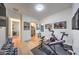 A view of the home gym, showcasing the exercise equipment with access to a full closet and another room at 461 Highview Ridge Ave, Las Vegas, NV 89138