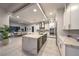 Bright modern kitchen with white cabinetry, stainless appliances, and a marble island at 461 Highview Ridge Ave, Las Vegas, NV 89138