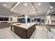 Modern kitchen with island, open layout, and adjacent dining area at 461 Highview Ridge Ave, Las Vegas, NV 89138