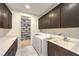 Laundry room featuring a sink, counter space, washer and dryer and a walk-in shoe closet at 461 Highview Ridge Ave, Las Vegas, NV 89138