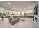 Open-concept living room with a bar, fireplace, and tile flooring at 461 Highview Ridge Ave, Las Vegas, NV 89138