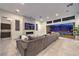 Spacious living room with fireplace and large windows with views of a water feature at 461 Highview Ridge Ave, Las Vegas, NV 89138