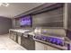 Well-equipped outdoor kitchen featuring a built-in grill, sink, and beverage cooler at 461 Highview Ridge Ave, Las Vegas, NV 89138