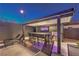 Outdoor kitchen features bar seating, a grill, and a mounted television at 461 Highview Ridge Ave, Las Vegas, NV 89138
