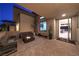 Covered outdoor patio with seating around a fire pit at 461 Highview Ridge Ave, Las Vegas, NV 89138