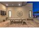 Covered outdoor patio area with exposed brick flooring, pool table, outdoor seating, and mountain views at 461 Highview Ridge Ave, Las Vegas, NV 89138