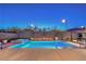 Stunning backyard featuring a pool, spa, and outdoor kitchen with bar seating at 461 Highview Ridge Ave, Las Vegas, NV 89138