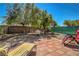 Charming backyard patio with comfortable seating and mature landscaping creating a serene outdoor space at 4802 Regalo Bello St, Las Vegas, NV 89135