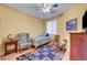 Cozy bedroom with carpet, ceiling fan and a view of the window at 4802 Regalo Bello St, Las Vegas, NV 89135