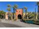 Attractive building with desert landscaping and walkway leading to arched entryway at 4802 Regalo Bello St, Las Vegas, NV 89135
