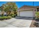Well maintained property features a large driveway leading to an attached two-car garage at 4802 Regalo Bello St, Las Vegas, NV 89135