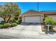 Well maintained home has a concrete driveway leading to a two car garage with mailbox at 4802 Regalo Bello St, Las Vegas, NV 89135