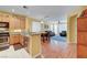 Eat in kitchen that opens up to the living room and dining room with stainless steel appliances at 4802 Regalo Bello St, Las Vegas, NV 89135
