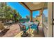 Outdoor patio featuring a table with seating and manicured landscaping at 4802 Regalo Bello St, Las Vegas, NV 89135