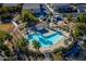 Aerial shot of community pool, palm trees, and residential parking at 4830 Double Down Dr # 102, Las Vegas, NV 89122