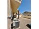 View of gravel backyard featuring privacy fence and HVAC system on the side of the house at 4830 Double Down Dr # 102, Las Vegas, NV 89122