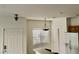 Kitchen featuring modern lighting, white appliances and bright window at 4830 Double Down Dr # 102, Las Vegas, NV 89122