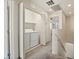 Hallway laundry closet with white bi-fold doors and a washer and dryer at 4830 Double Down Dr # 102, Las Vegas, NV 89122