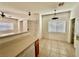 Living room with tile floor, a ceiling fan, and a kitchen counter at 4830 Double Down Dr # 102, Las Vegas, NV 89122