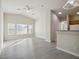 Bright living room featuring wood floors, ceiling fan, and large windows at 4830 Double Down Dr # 102, Las Vegas, NV 89122