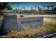 An exterior stone sign reads 'Nevada Ranch', surrounded by desert shrubs near the entrance at 4830 Double Down Dr # 102, Las Vegas, NV 89122