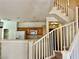 Staircase in a home with wood cabinets and a kitchen in the background at 4830 Double Down Dr # 102, Las Vegas, NV 89122