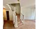 Carpeted staircase and living room space in a home's interior at 4830 Double Down Dr # 102, Las Vegas, NV 89122