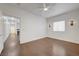 Large bedroom with wood floors, modern sconces, and ample natural light at 5250 S Rainbow Blvd # 2183, Las Vegas, NV 89118