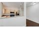 Open kitchen with breakfast bar, stainless appliances, and wood floors at 5250 S Rainbow Blvd # 2183, Las Vegas, NV 89118