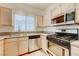 Well-equipped kitchen with stainless appliances, and light wood cabinets at 5250 S Rainbow Blvd # 2183, Las Vegas, NV 89118
