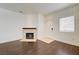 Well-lit living room with a charming fireplace and an inviting, spacious atmosphere at 5250 S Rainbow Blvd # 2183, Las Vegas, NV 89118