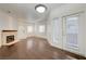 A spacious living room boasts hardwood floors, a fireplace, and natural light at 5250 S Rainbow Blvd # 2183, Las Vegas, NV 89118