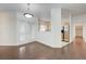 Bright living room with hardwood floors, white walls, and stainless steel appliances at 5250 S Rainbow Blvd # 2183, Las Vegas, NV 89118