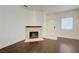 Living room featuring modern hardwood floors, a fireplace and a bright, neutral color palette at 5250 S Rainbow Blvd # 2183, Las Vegas, NV 89118