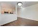 View of the living space extending to the kitchen, complete with modern lighting at 5250 S Rainbow Blvd # 2183, Las Vegas, NV 89118