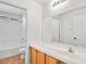 Bathroom featuring tile flooring, a vanity sink, and a shower at 5373 Blue Oat Ave, Las Vegas, NV 89141
