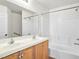 Bathroom featuring double sinks, shower and bathtub at 5373 Blue Oat Ave, Las Vegas, NV 89141