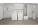 Garage with washer, dryer, and water heater at 5373 Blue Oat Ave, Las Vegas, NV 89141