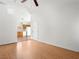 Spacious living room with vaulted ceiling and laminate wood flooring at 5373 Blue Oat Ave, Las Vegas, NV 89141