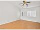 Living room with laminate wood flooring, a ceiling fan, and a front door at 5373 Blue Oat Ave, Las Vegas, NV 89141