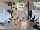 An aerial shot reveals a desert property with a pool, solar panels, and low-maintenance landscaping at 5450 Grain Mill Rd, Pahrump, NV 89061