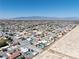 Expansive aerial view of the community showcasing stunning mountain views and many neighborhood homes at 5450 Grain Mill Rd, Pahrump, NV 89061